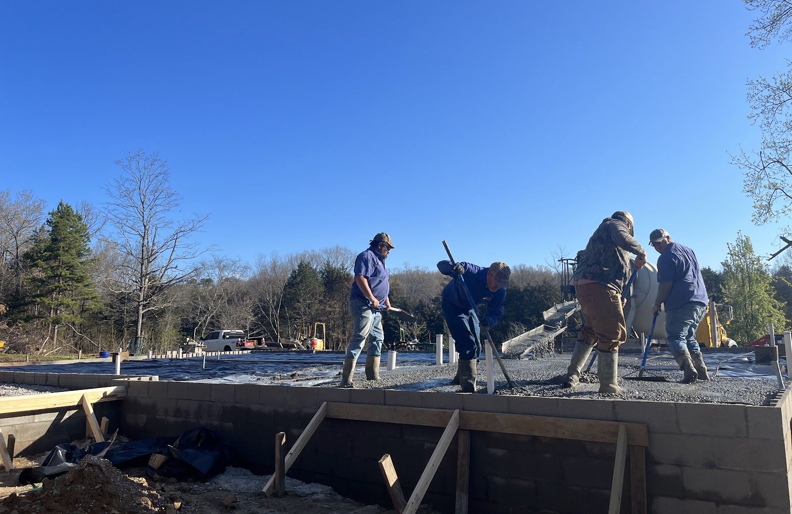The Circle M crew finishing a concrete foundation