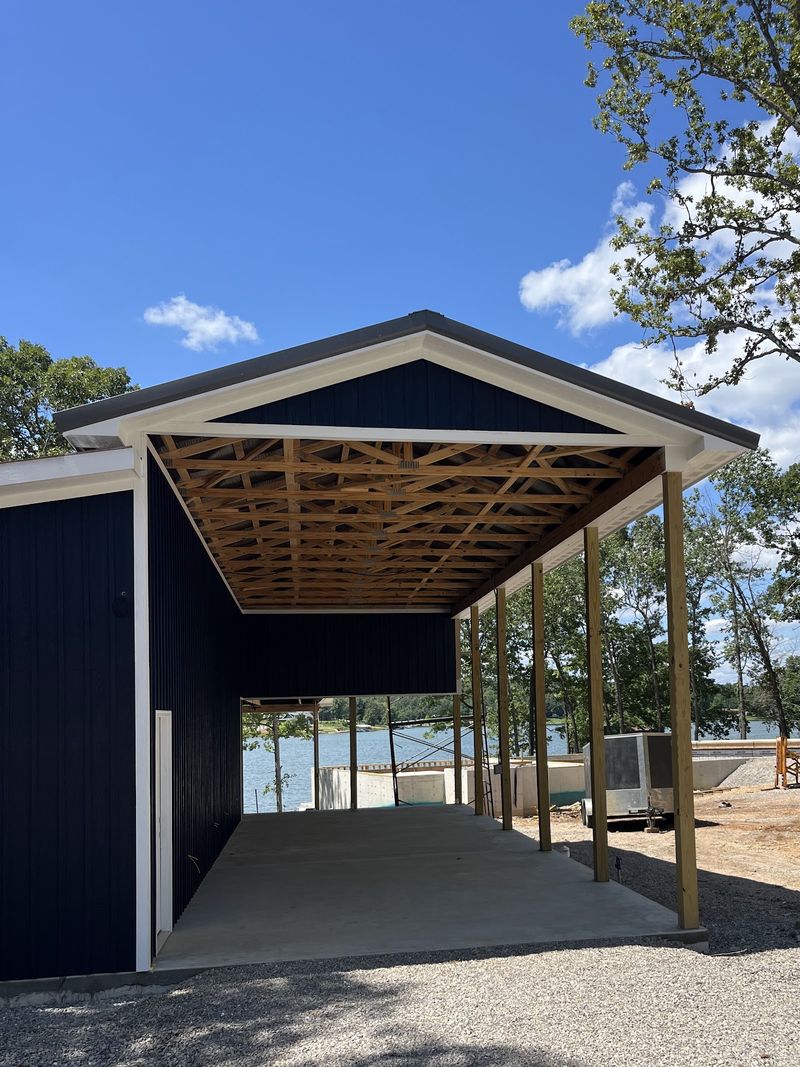 A covered drive-through breezeway framed in timber