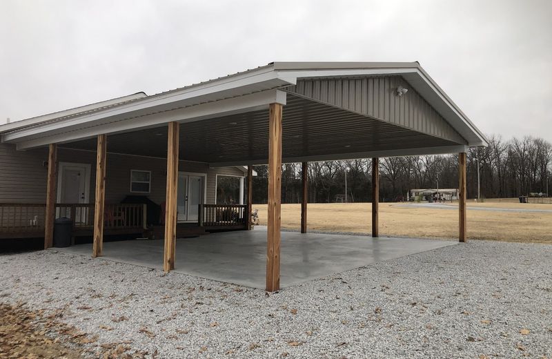 An open-sided post-frame pavilion with timber posts